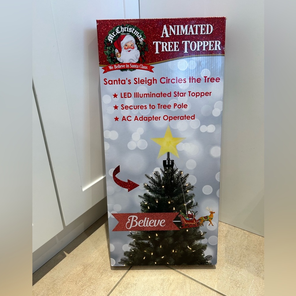 Mr. Christmas animated tree topper Santa’s sleigh circles the tree
